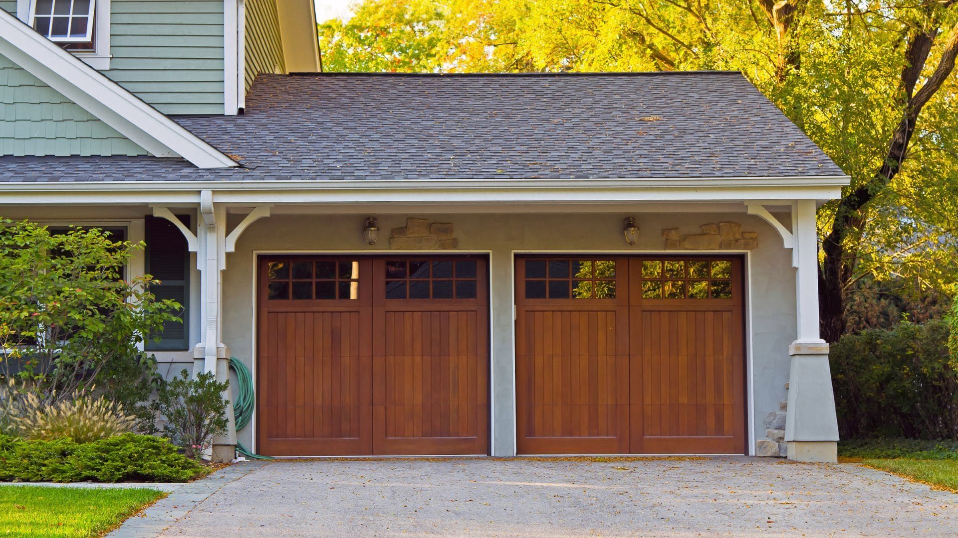 Two wood carriage-house garage doors on a craftsman home